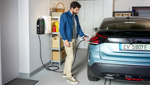 A person holding a charging station