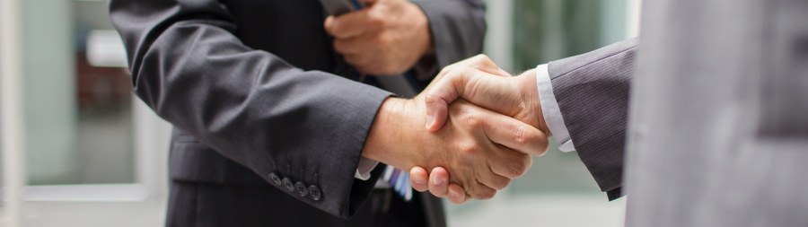 Closeup shot of hand shake by two men