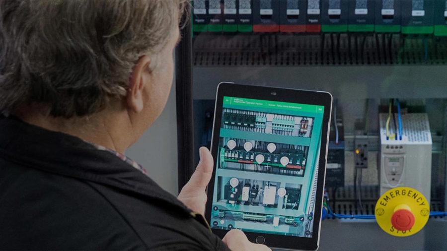 Man using tablet to connect with Machine