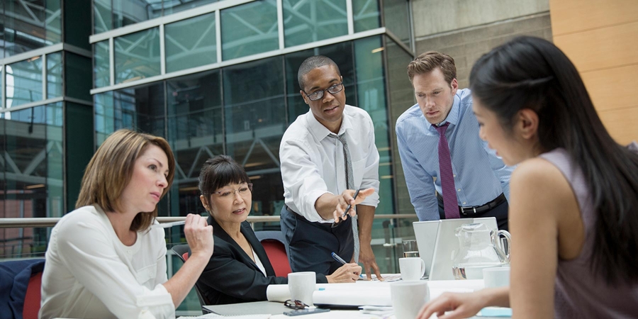 People discussing in office