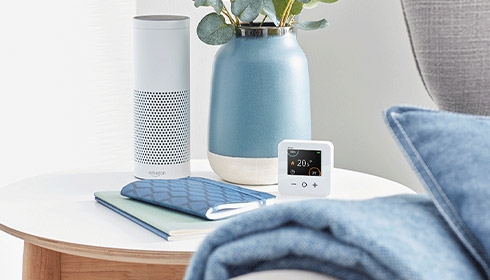 A white electronic device on a table