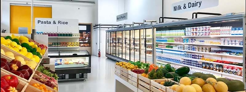 A grocery store with produce in the fridge