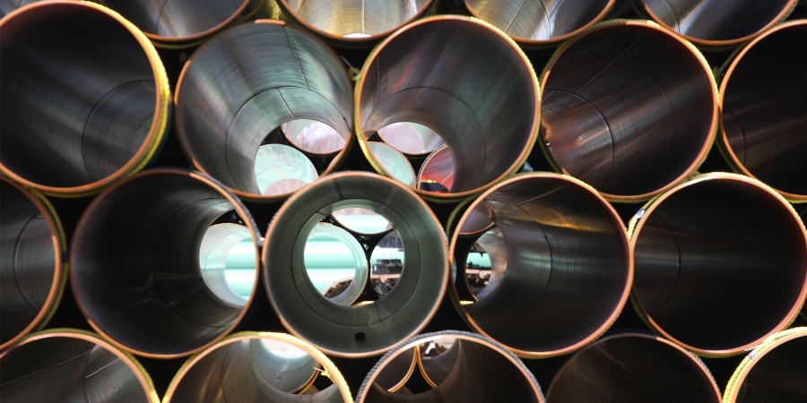 closeup of steel pipelines in an oil industry