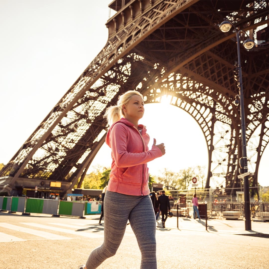 A woman jogging near Eiffel Tower