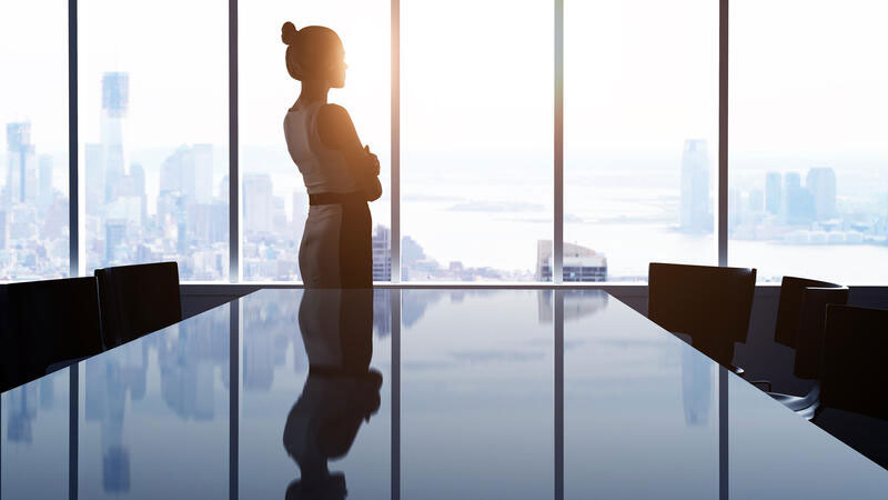 woman looking at modern city