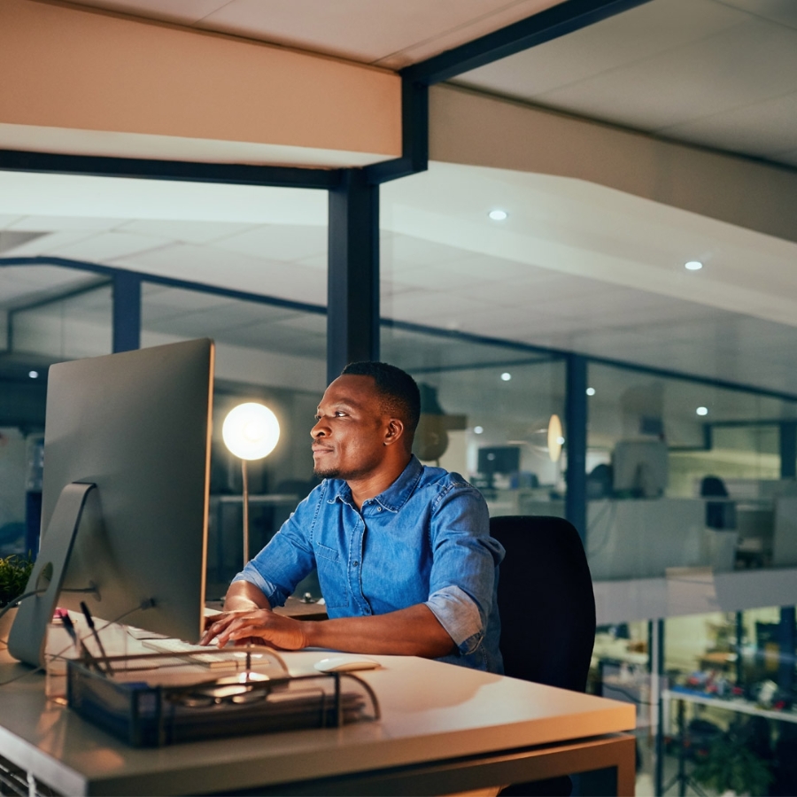 man in office with desktop