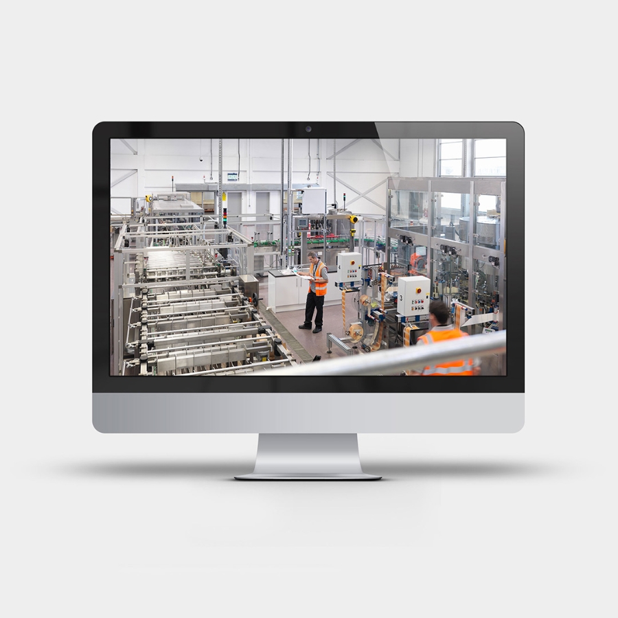 Wide angle inside view of a factory shown on a desktop computer screen