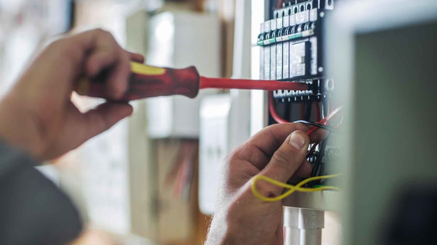A technician repairing an electric module