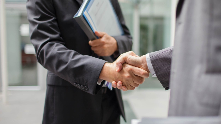 Closeup shot of two men shaking hands