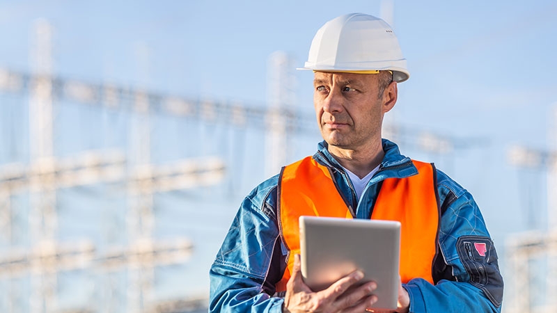 an Engineer using tablet on site
