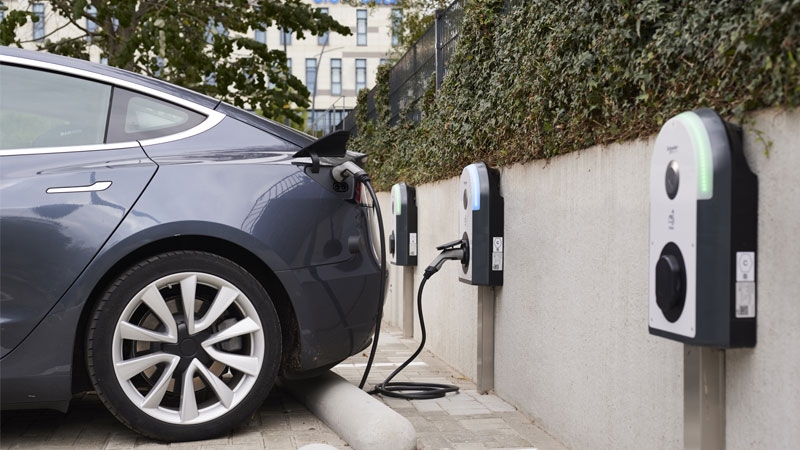 Electrical vehicle chargers and car at a parking lot