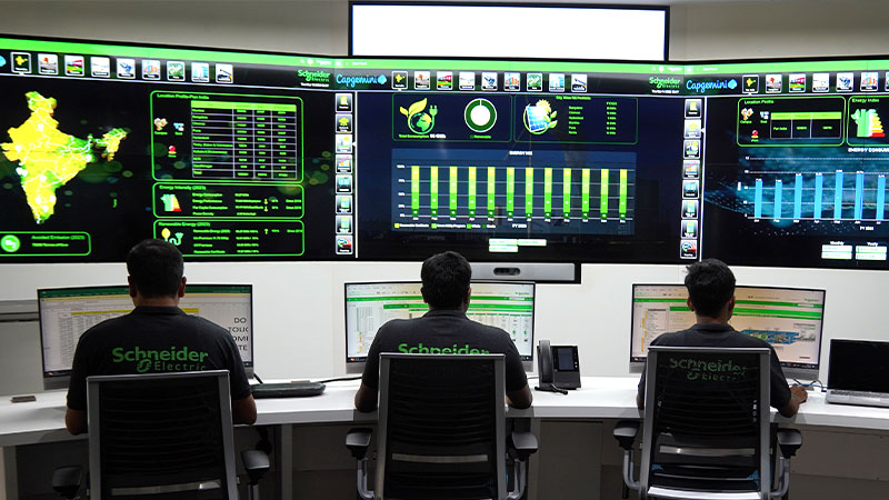 three SE employees working on systems