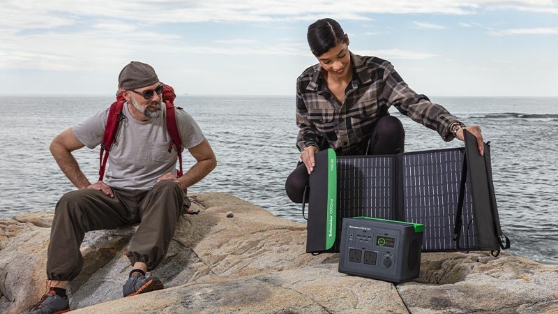 A men or girl sitting on the beach
