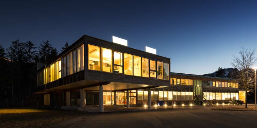 Ecological energy saving wooden office building at night