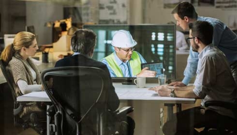 Architects and project manager in a video conference meeting with engineer