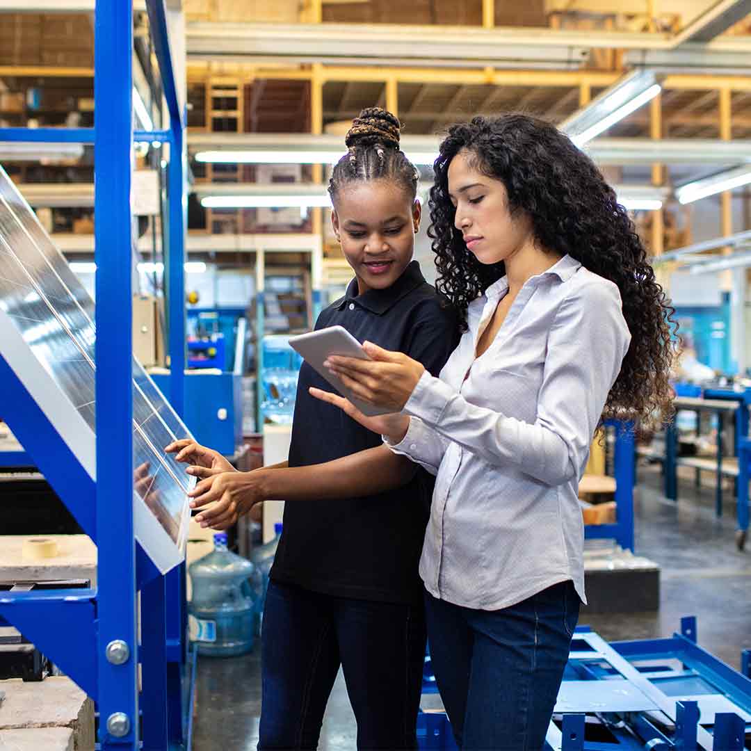 two girls work in smart factory