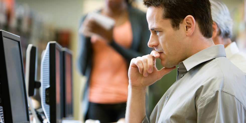 Business people working on computers, facility management software, internet of things.