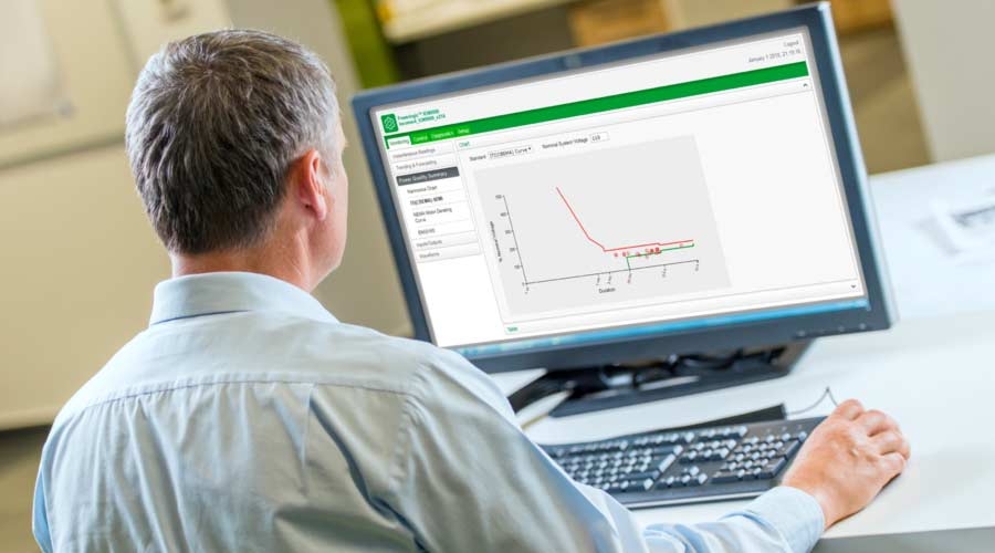 Man looking at monitor displaying Power Quality screen from ION9000 meter