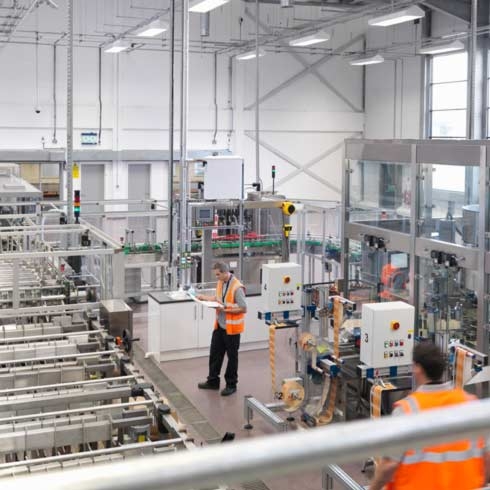 Factory workers in bottling plant