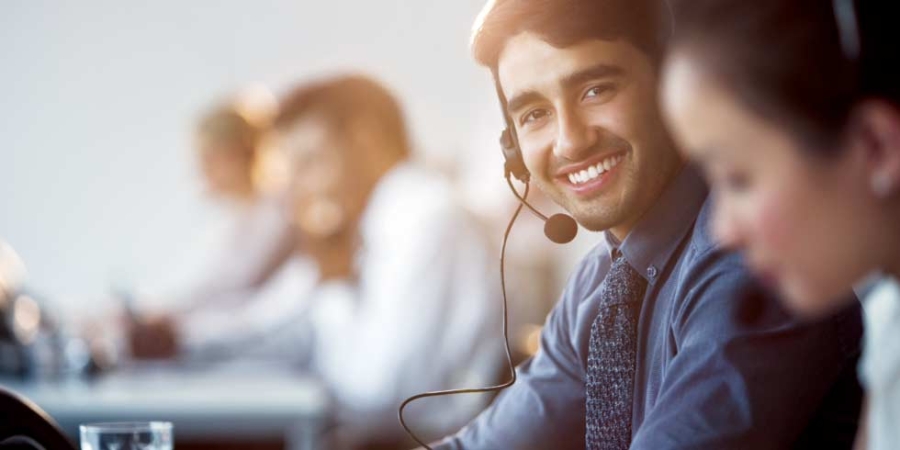 Businessman wearing headset in office, sustainability consulting