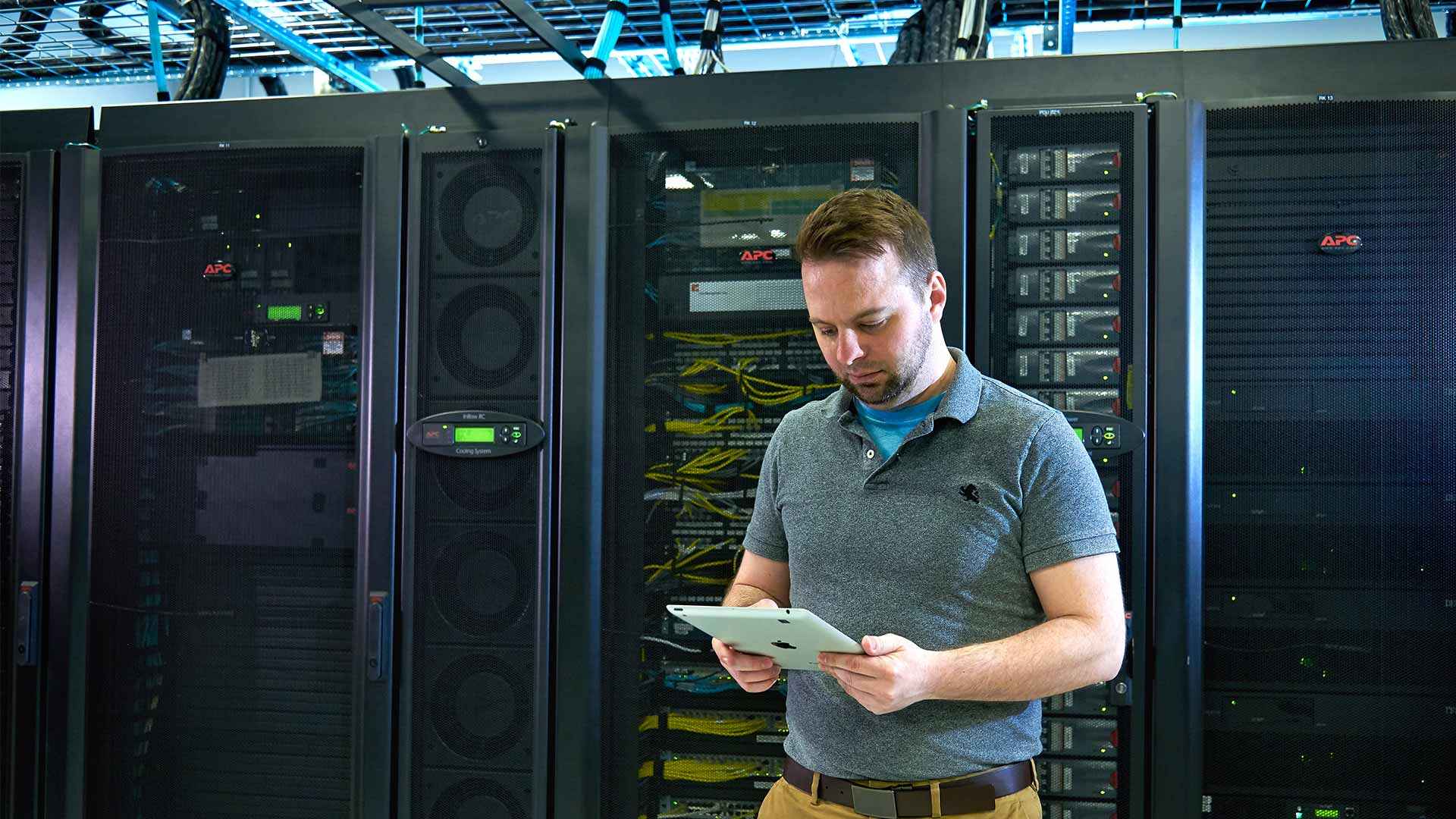 A man with tablet in a digital data center