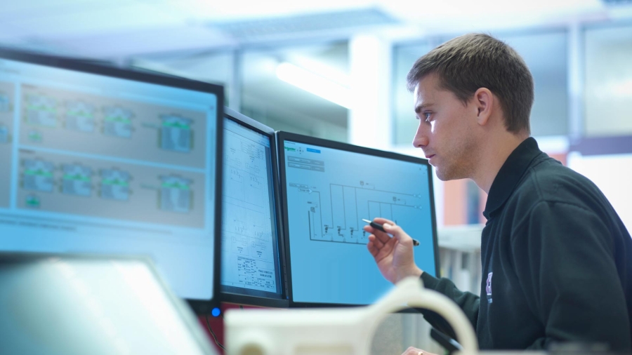 Employee working at a control room