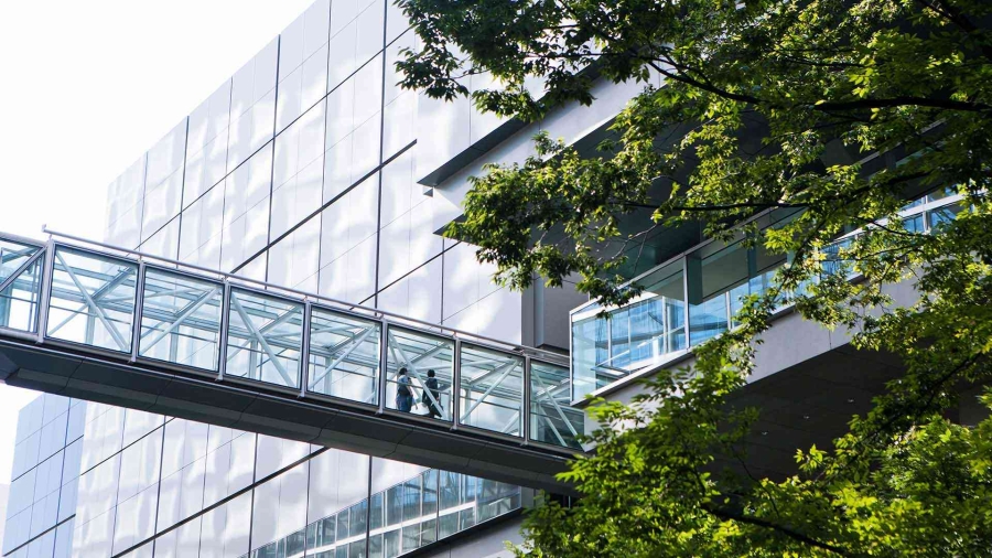 Office Building Exterior with elevated glass walkway