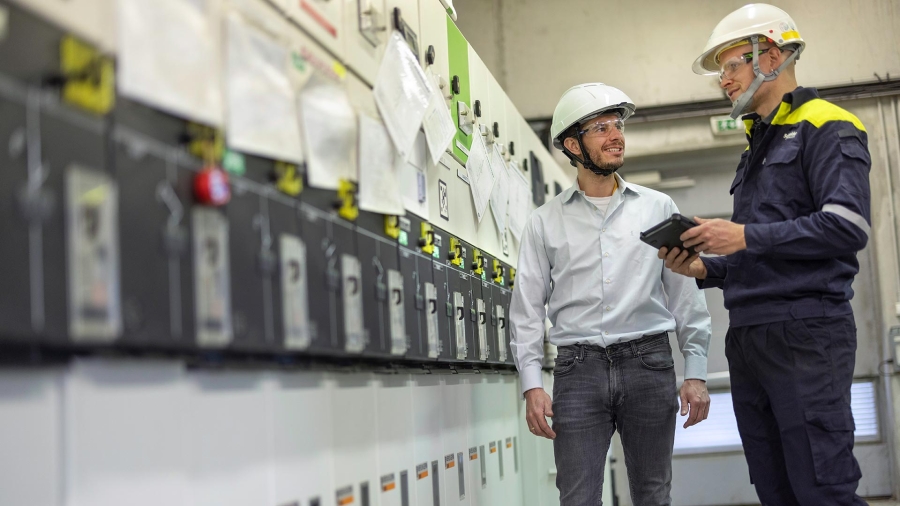 two service technicians monitoring asset health of electrical distribution equipment