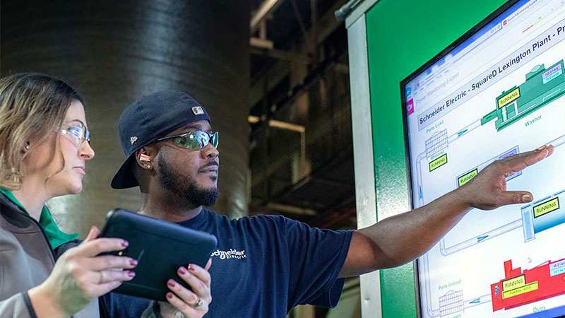 A female and a male employee at Schneider Electric Lexington Smart Factory