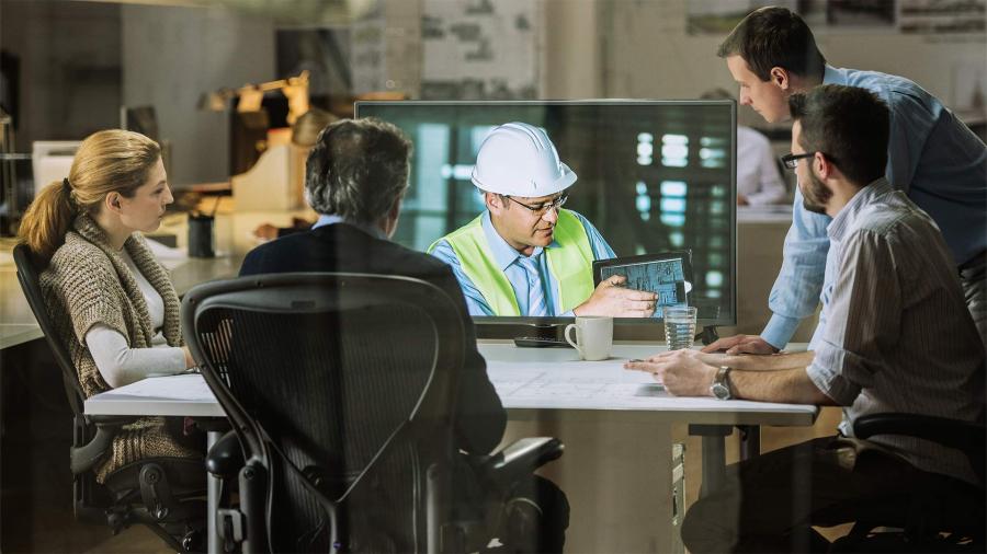 Architects and project manager in a video conference meeting with engineer