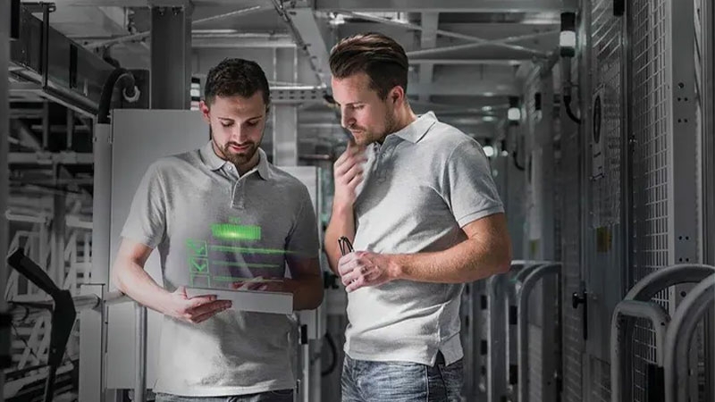 Two young men located in a place with databases.