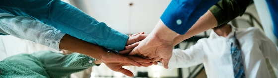 A group of people holding hands