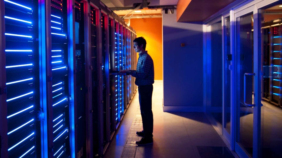 A person standing in a server room