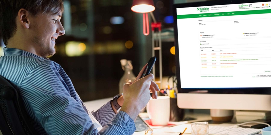 A person using a phone at a desk