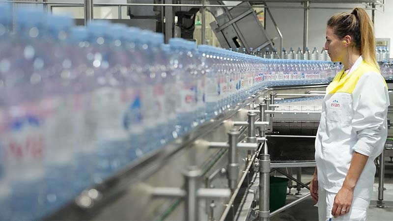 A line of bottles on a conveyor belt