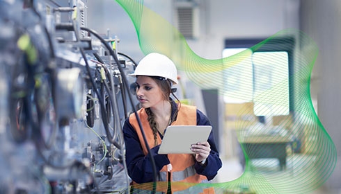 Female engineer holding a tablet in a facility