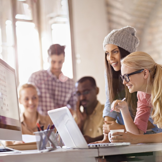 employees with laptop at work