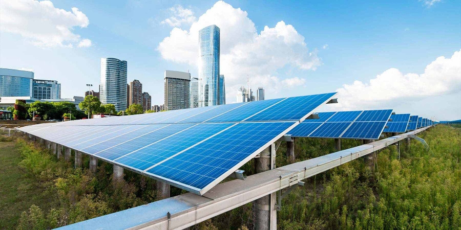 image of solar panels with city in the background