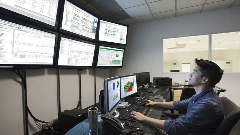 Services technician working in the control room 